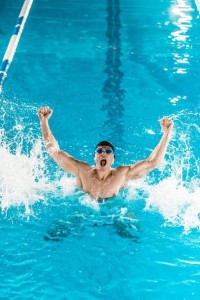 stock-photo-excited-swimmer-in-pool.jpg
